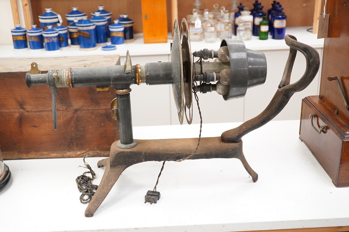 An early 20th century ophthalmic keratometer, designed to allow opticians to establish the curvature of a patient’s eye, constructed of cast-iron, brass and tin, and fitted with electric lamps and early celluloid scales,
